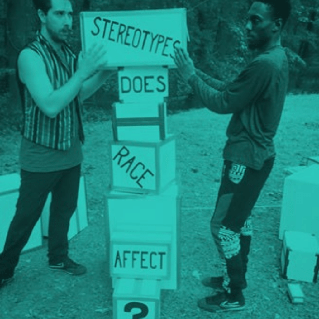 two people stacking blocks that say "stereotypes, does, race, affect"