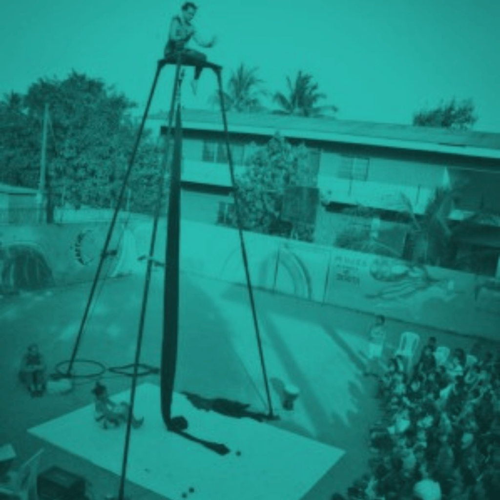 person on very high platform overlooking crowd